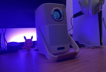 Yaber T2 projector running on a wooden desk with PS5 Pro