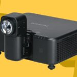 Fujifilm FP-ZUH6000 projector on a yellow background