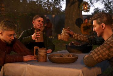 Kingdom Come: Deliverance 2 screenshot showing a group of medieval men sitting at a table with food, cheering together with wooden mugs of beer lifted high