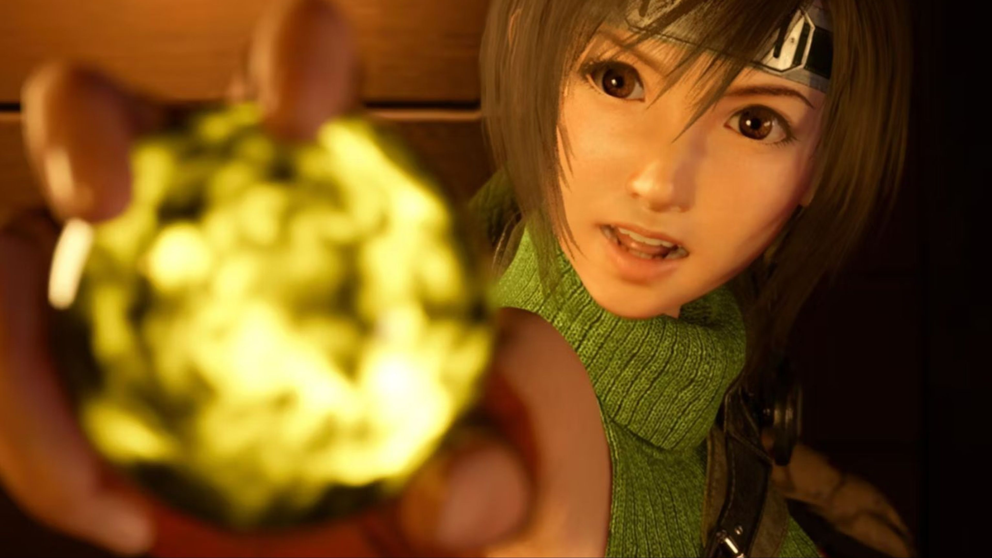 Yuffie holding up a piece of Yellow Materia toward the camera in Final Fantasy 7 Rebirth.