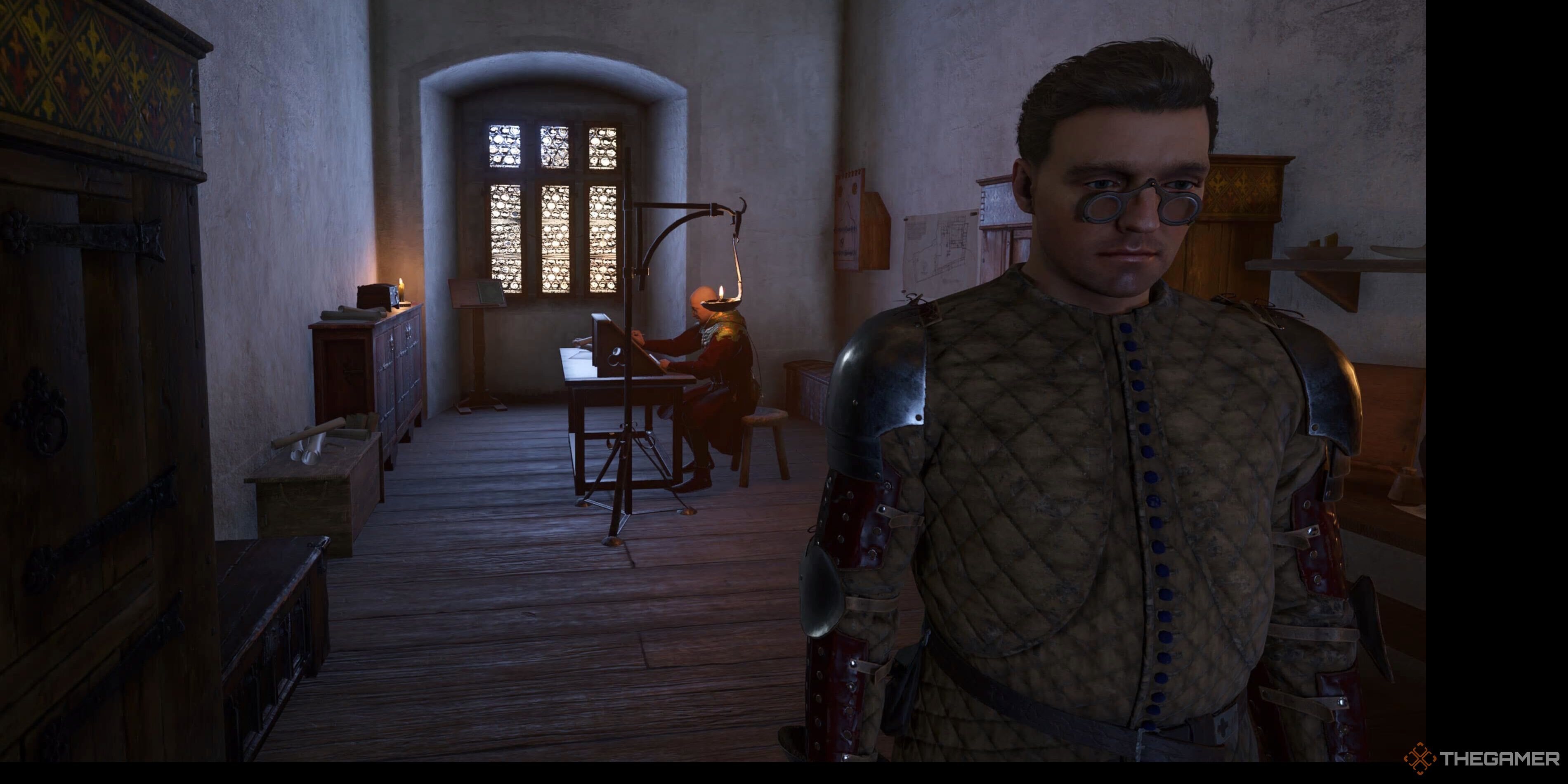 Henry in front of a scribe in Kingdom Come: Deliverance 2.