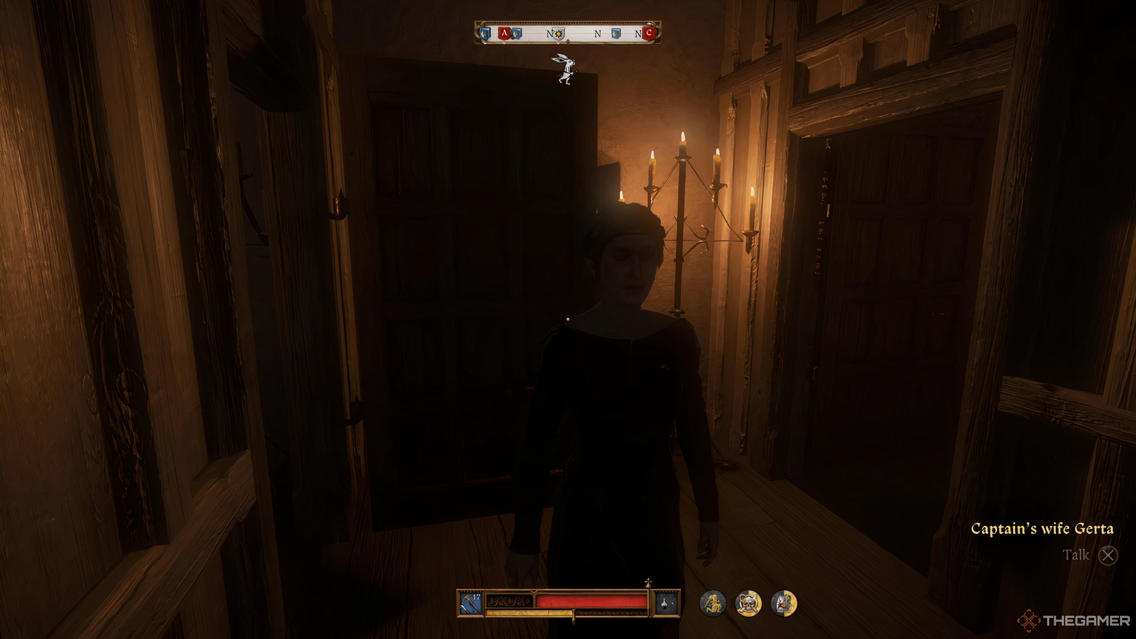 Lady Frenzl in a dark room in Kingdom Come: Deliverance 2.