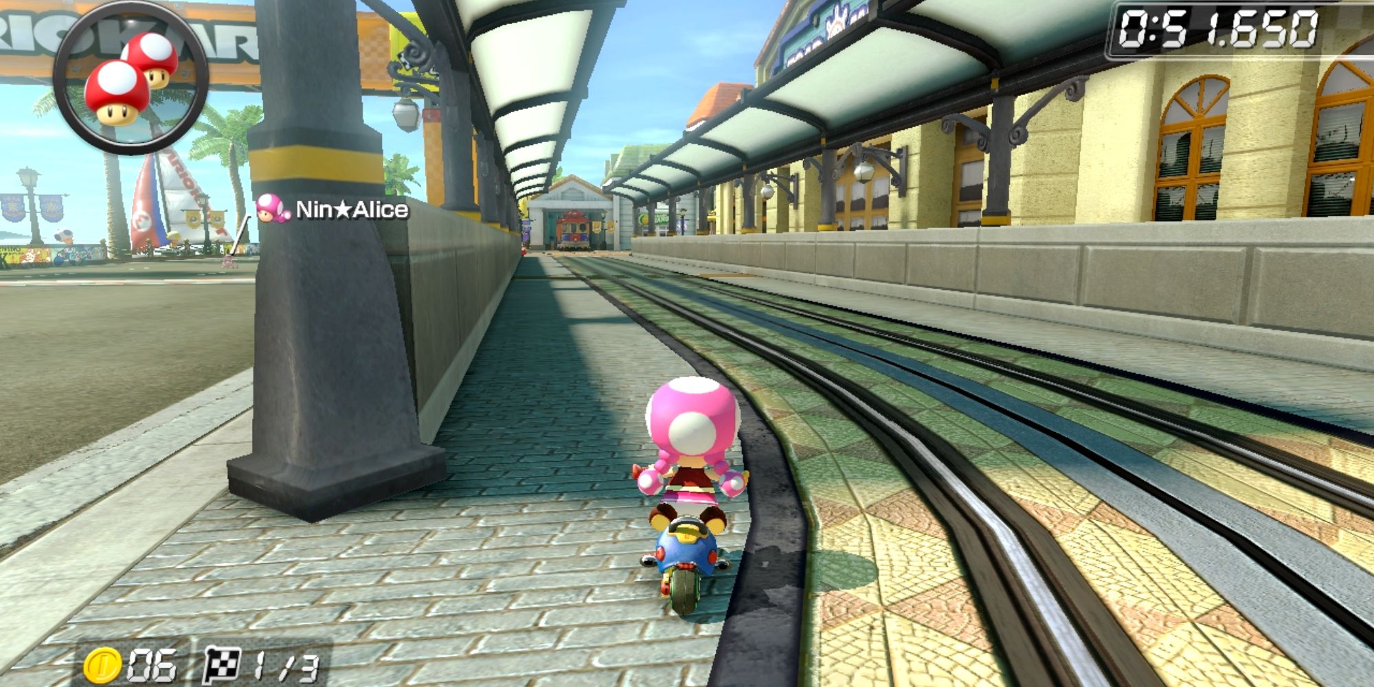 Toadette racing on train tracks in Toad Harbor