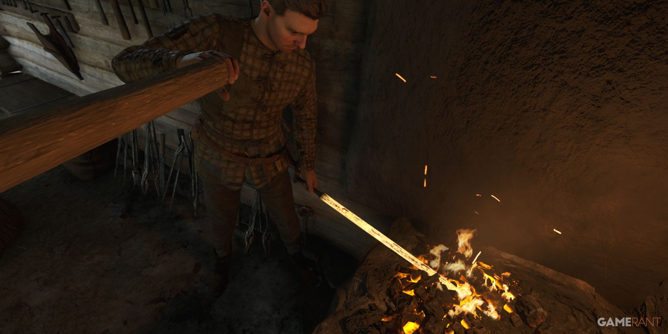 Henry in the blacksmith forge in Kingdom Come: Deliverance