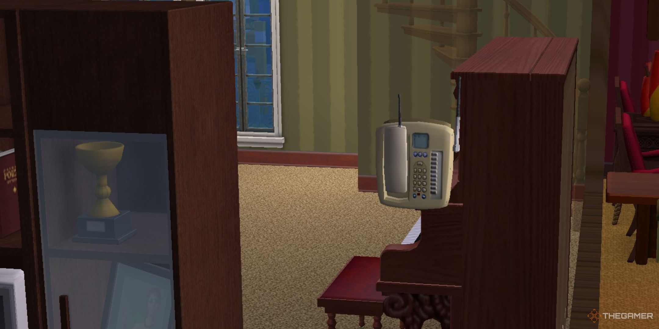 A phone is shown in The Sims 2.-1