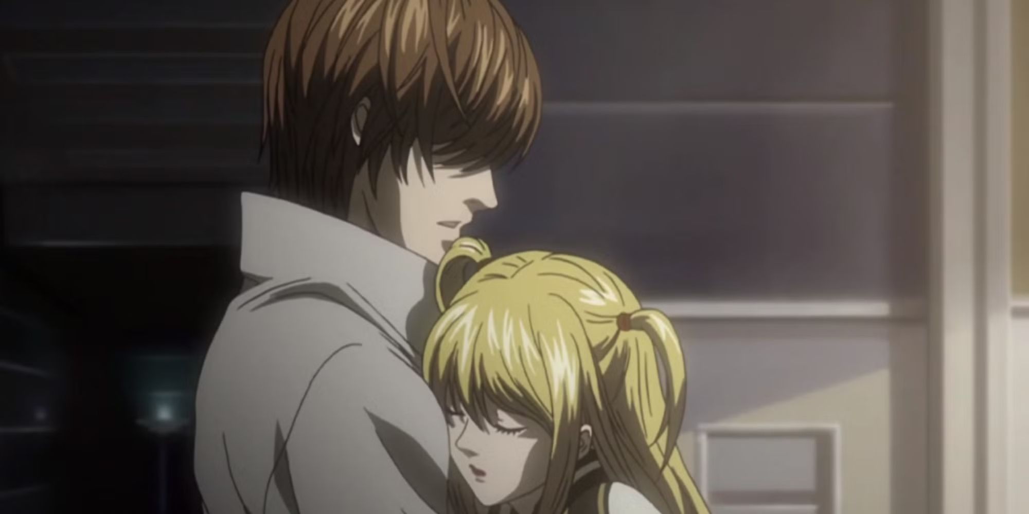 Light and Misa hugging in Death Note