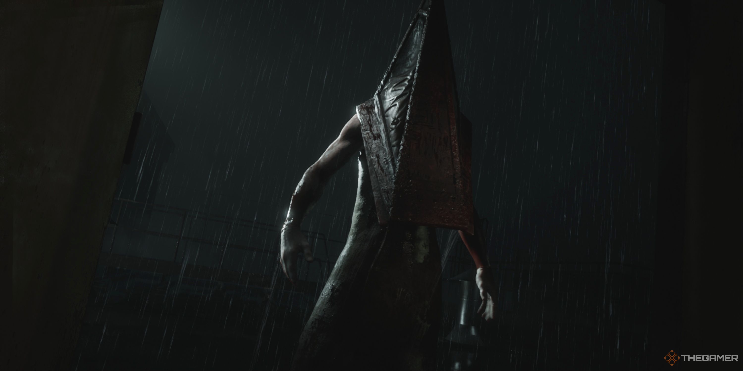 Silent Hill 2 - A close-up of Pyramid Head in the rain after he threw James down from the Brookhaven Hospital roof.