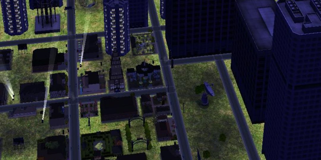 The downtown city of Downtown is shown. It is a skyscraper filled area at nighttime.