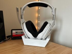 Astro A50 X headset in dock on a wooden table