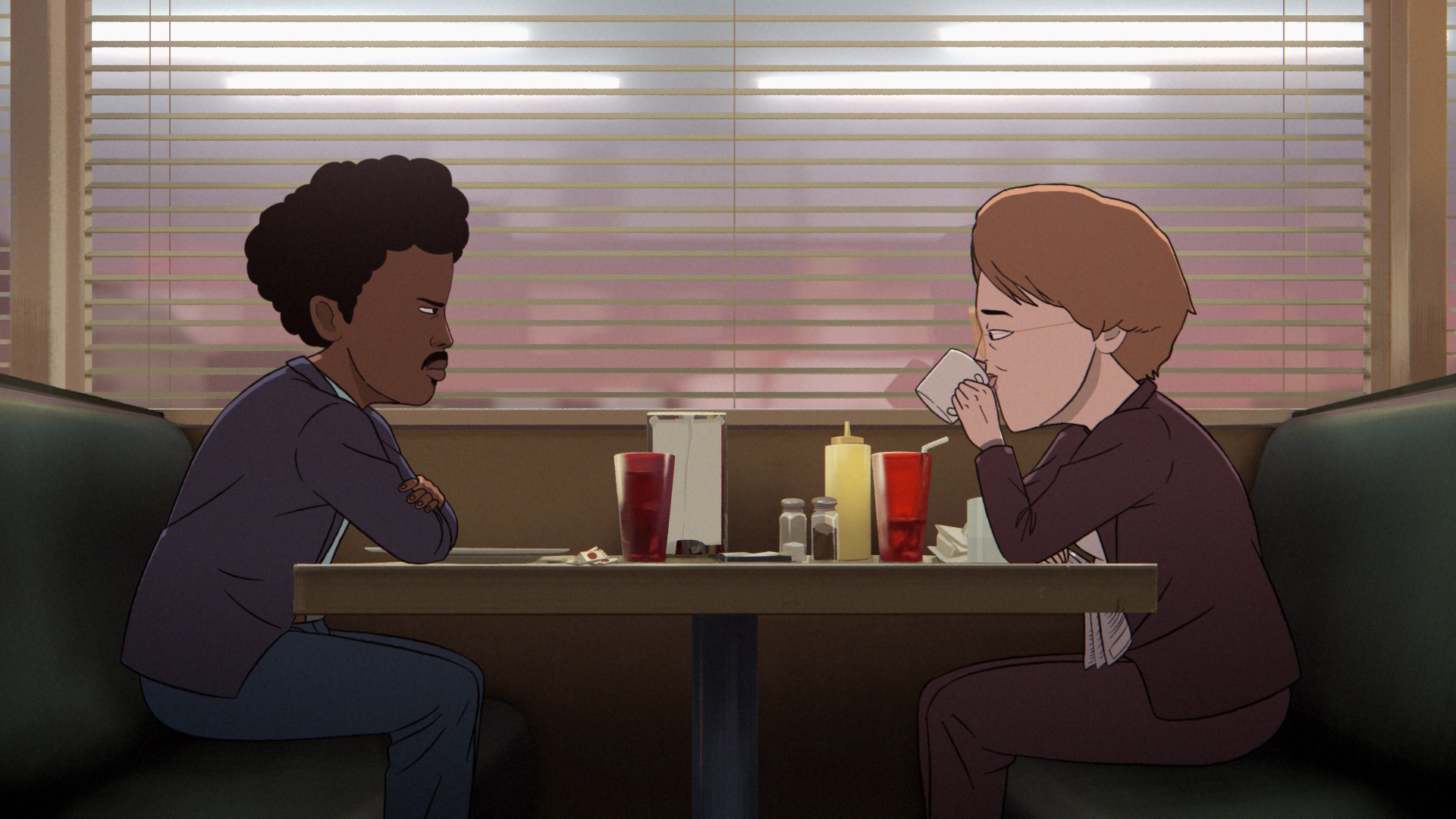 Common Side Effects still of Agents Copano and Harrigton eating at a diner