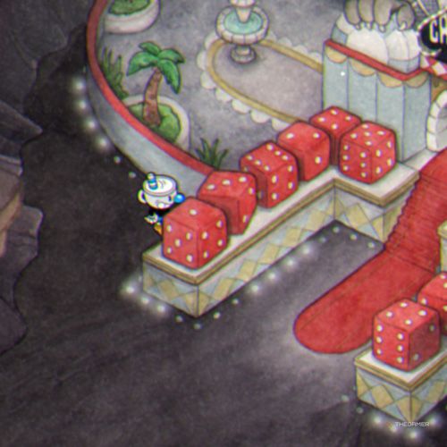 Mugman is standing next to dices on Inkwell Hell in Cuphead