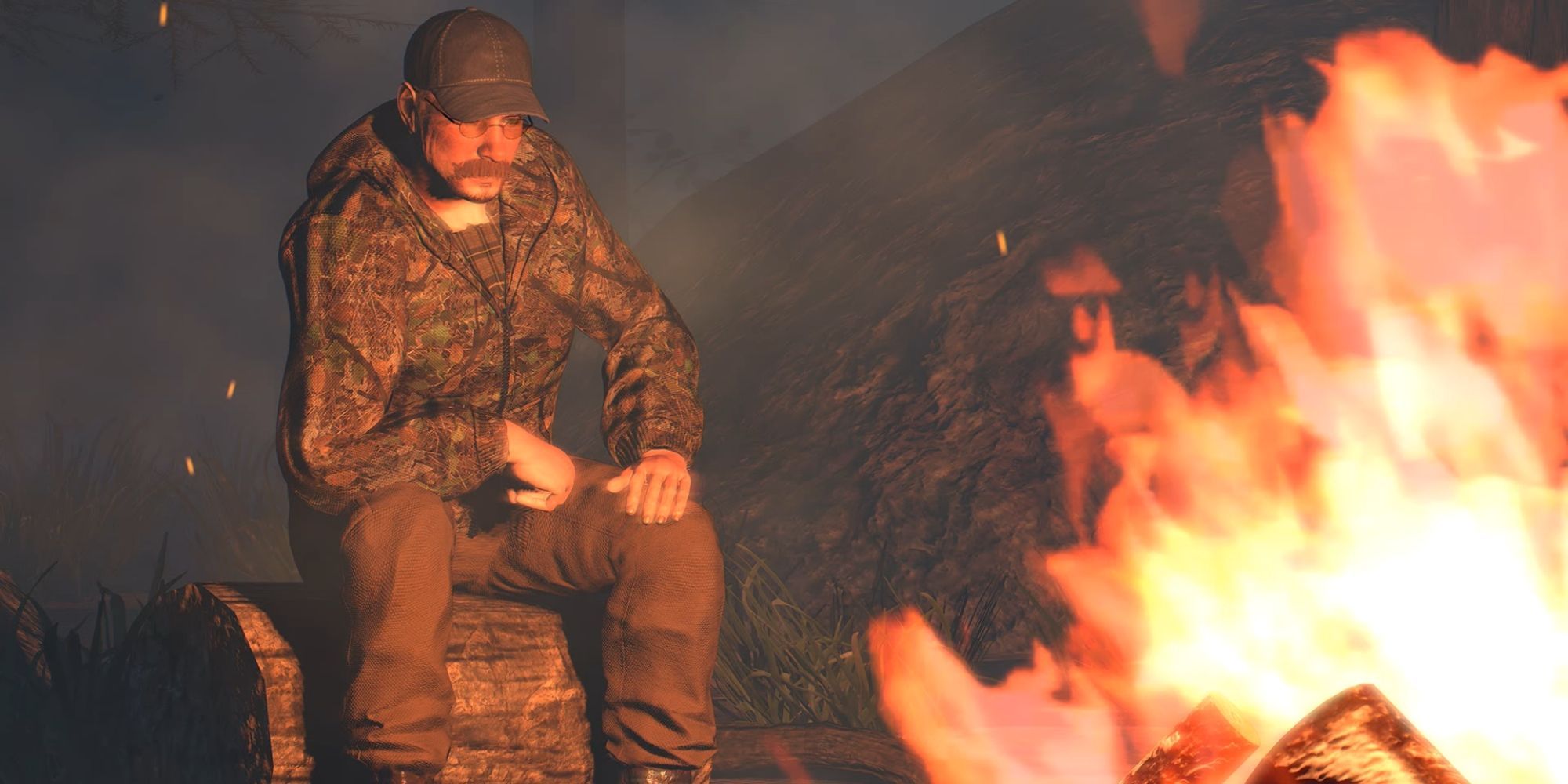 a man in hunting clothes sits by a fire