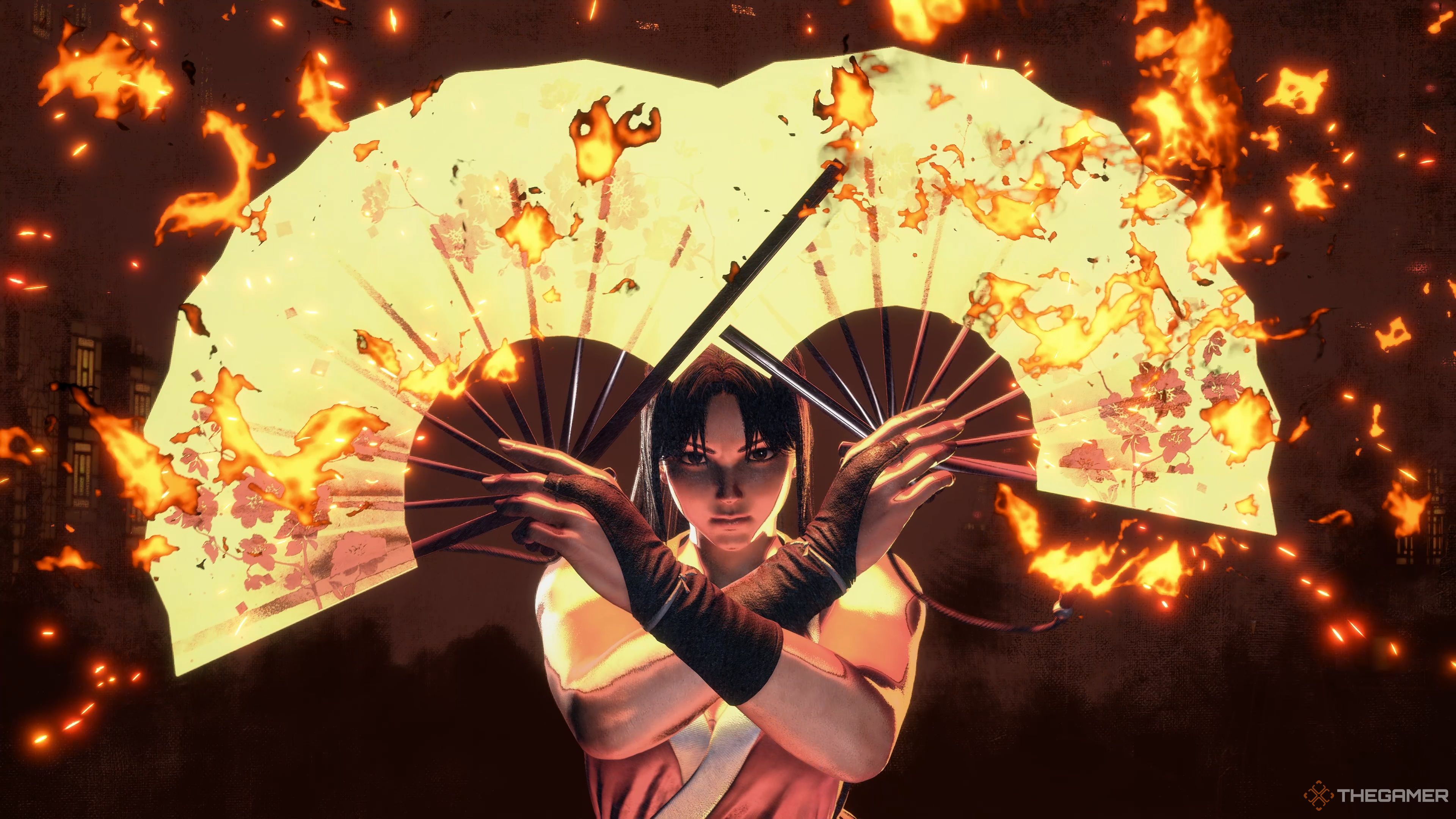 Mai opening her Tessens, coating them in flame, as she executes her Shiranui Ryuu: Enbu Ada Zakura Special Art in Street Fighter 6.