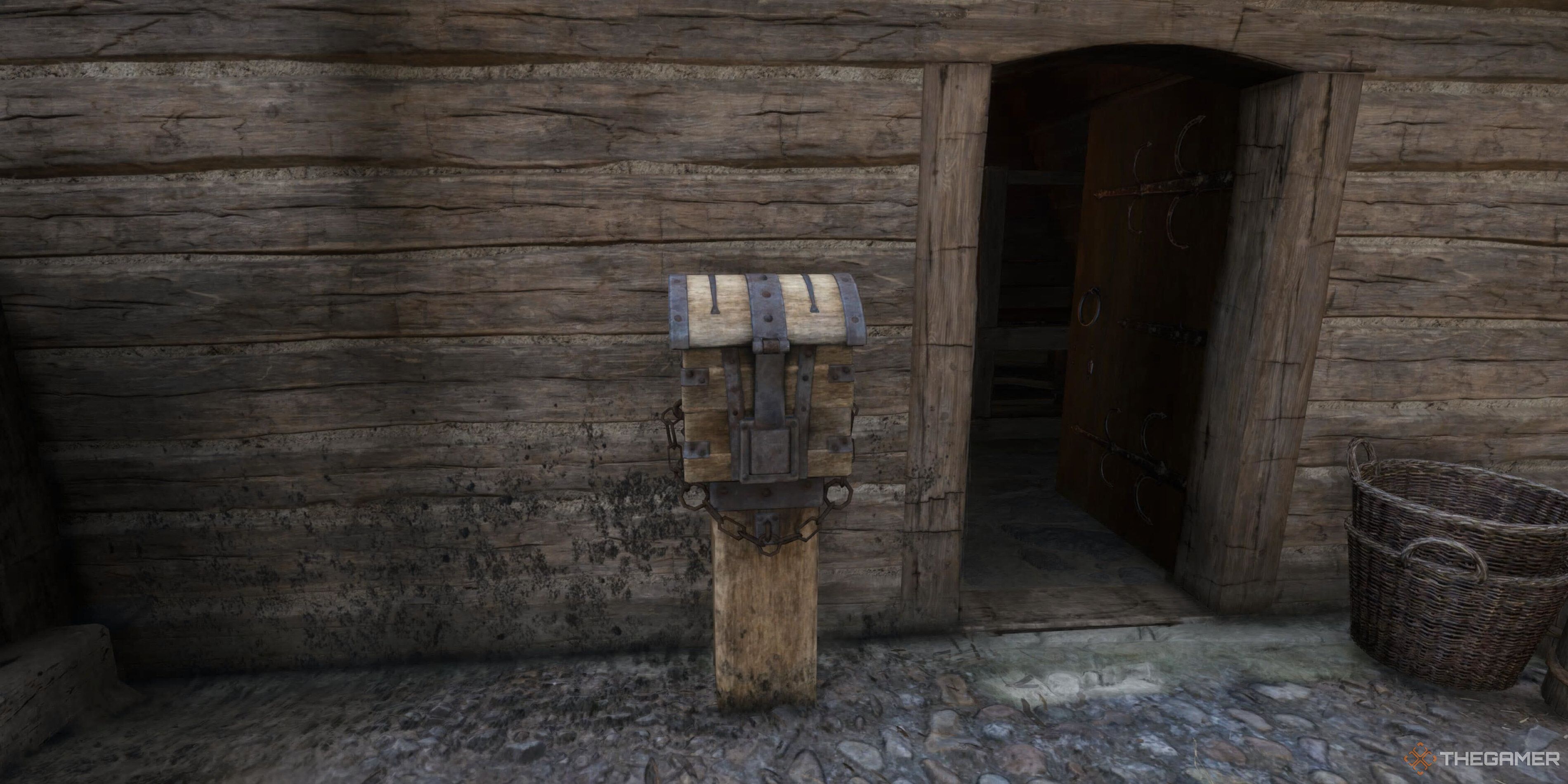 An Indulgence Chest outside a building in Kingdom Come: Deliverance 2.