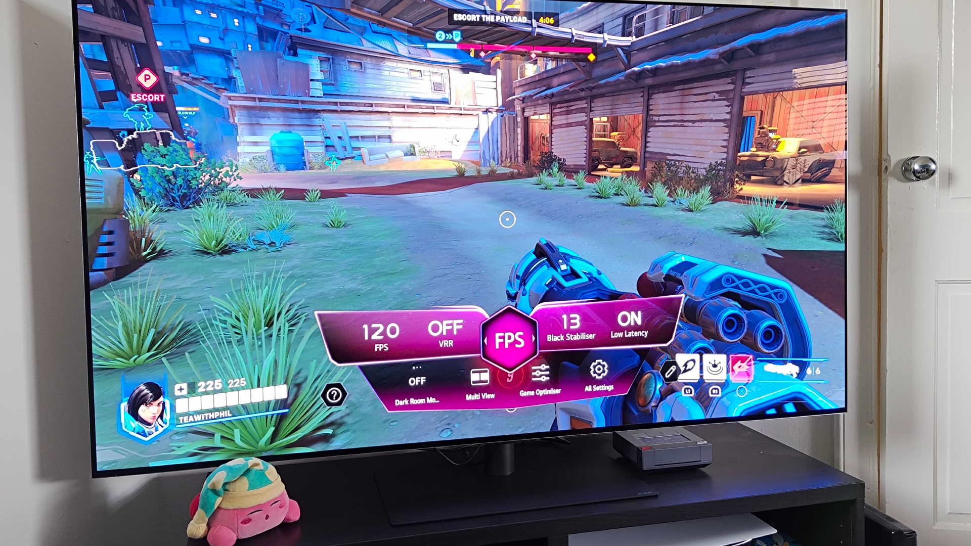 LG OLED G4 with game hub menu active and Overwatch 2 gameplay on display