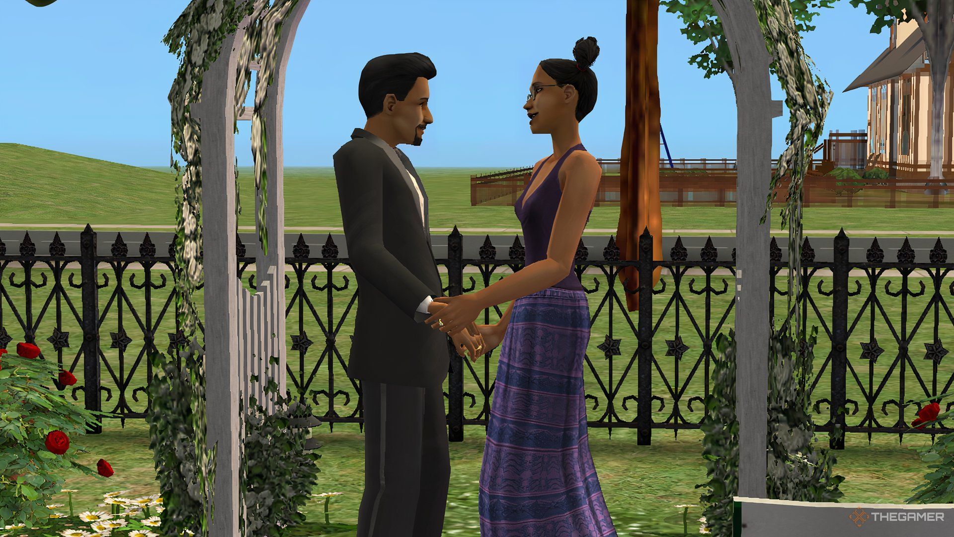 The Sims 2 Don Lothario holding hands with Cassandra Goth under a romantic floral archway.