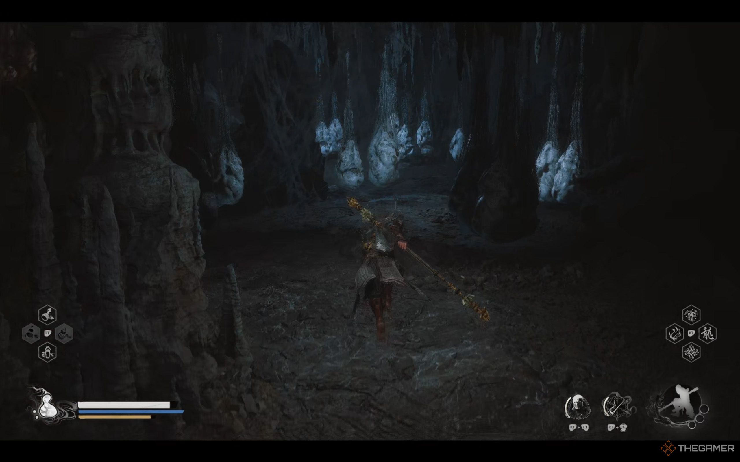 Wukong runs through a tunnel filled with white spider sacs.