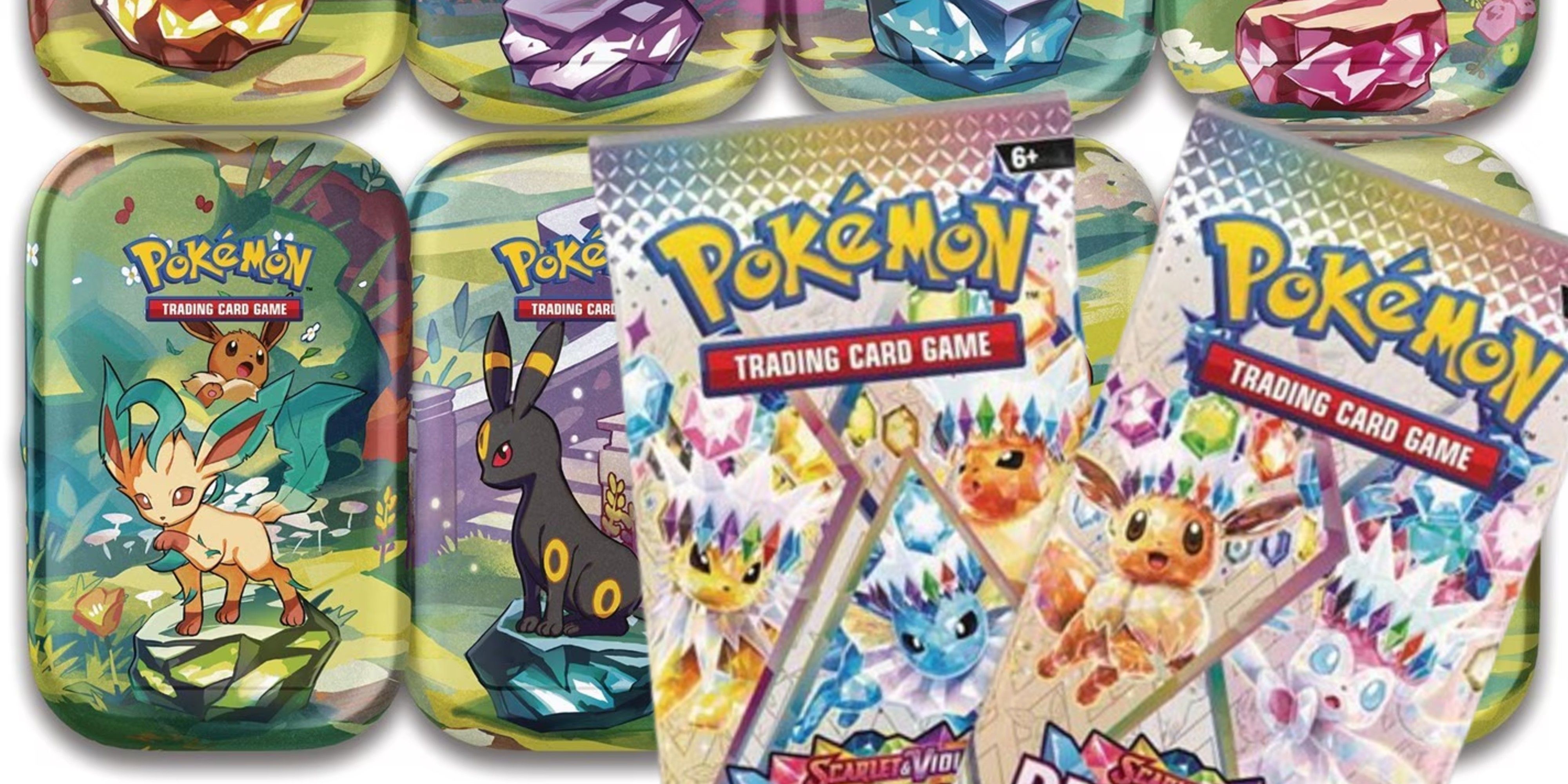 packs of prismatic evolutions pokemon cards in front of prismatic evolitions mini tins.