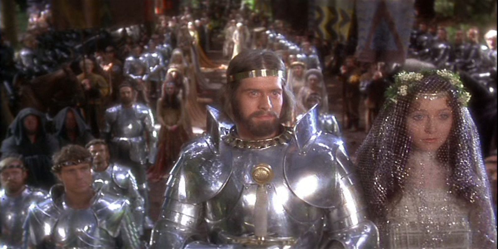 Excalibur wedding scene Arthur Guenivere foreground pouty Lancelot in background