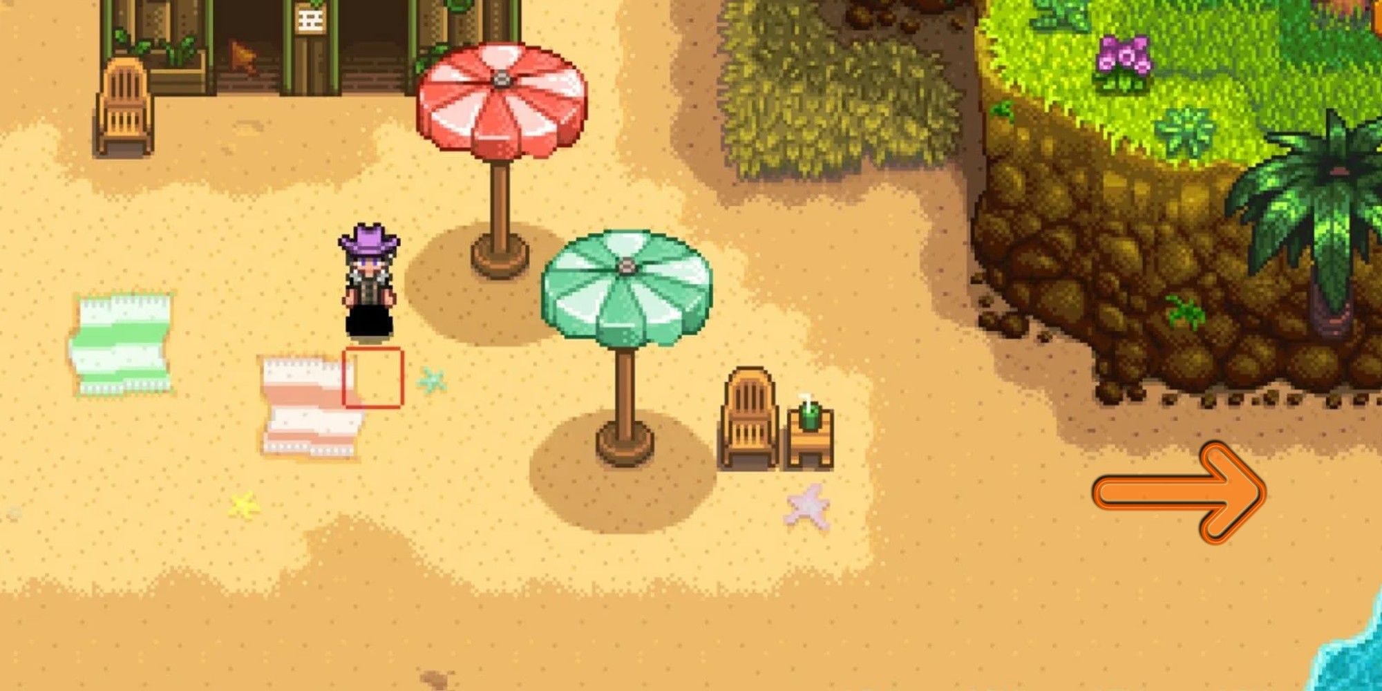 An arrow pointing to entrance of pirate cove area near beach chair and umbrellas in Stardew Valley.