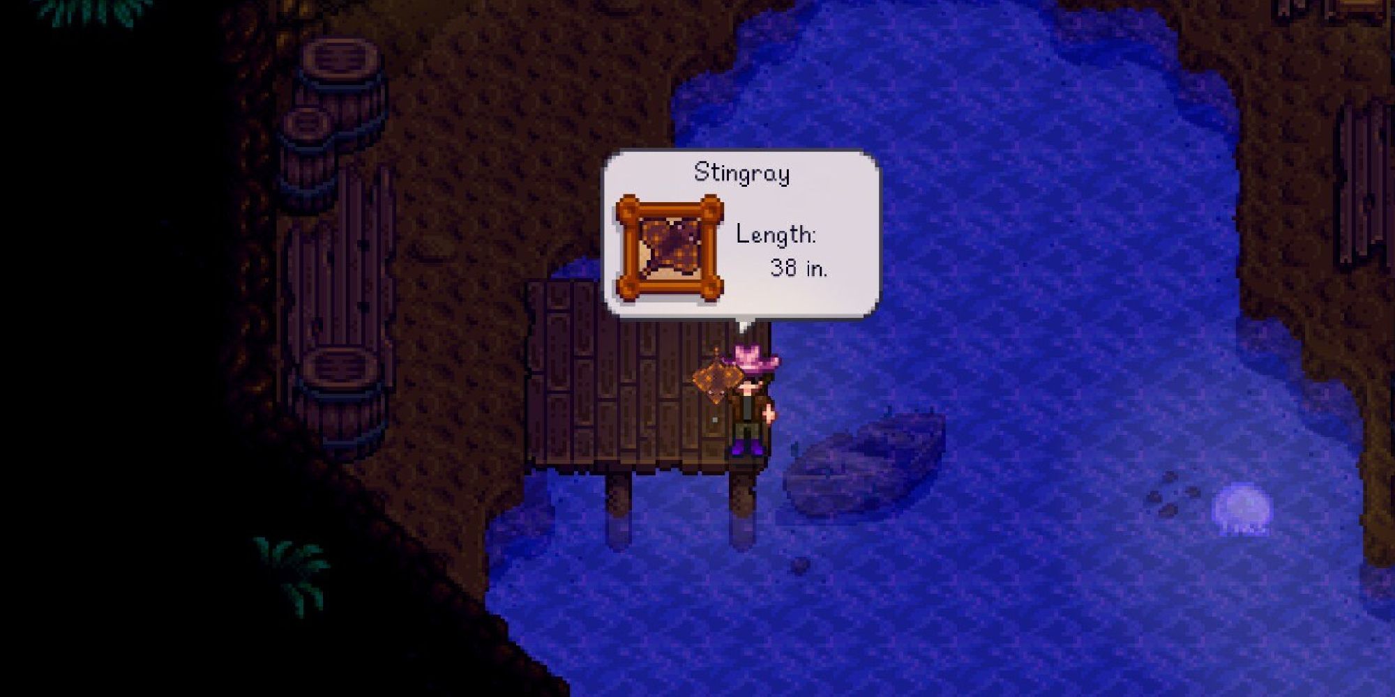 A player holding a stingray fish on a dock in Stardew Valley.