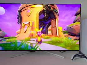 Philips Evnia 42M2N8900 monitor with Spyro the Dragon gameplay on screen