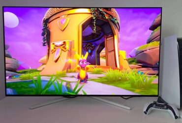 Philips Evnia 42M2N8900 monitor with Spyro the Dragon gameplay on screen