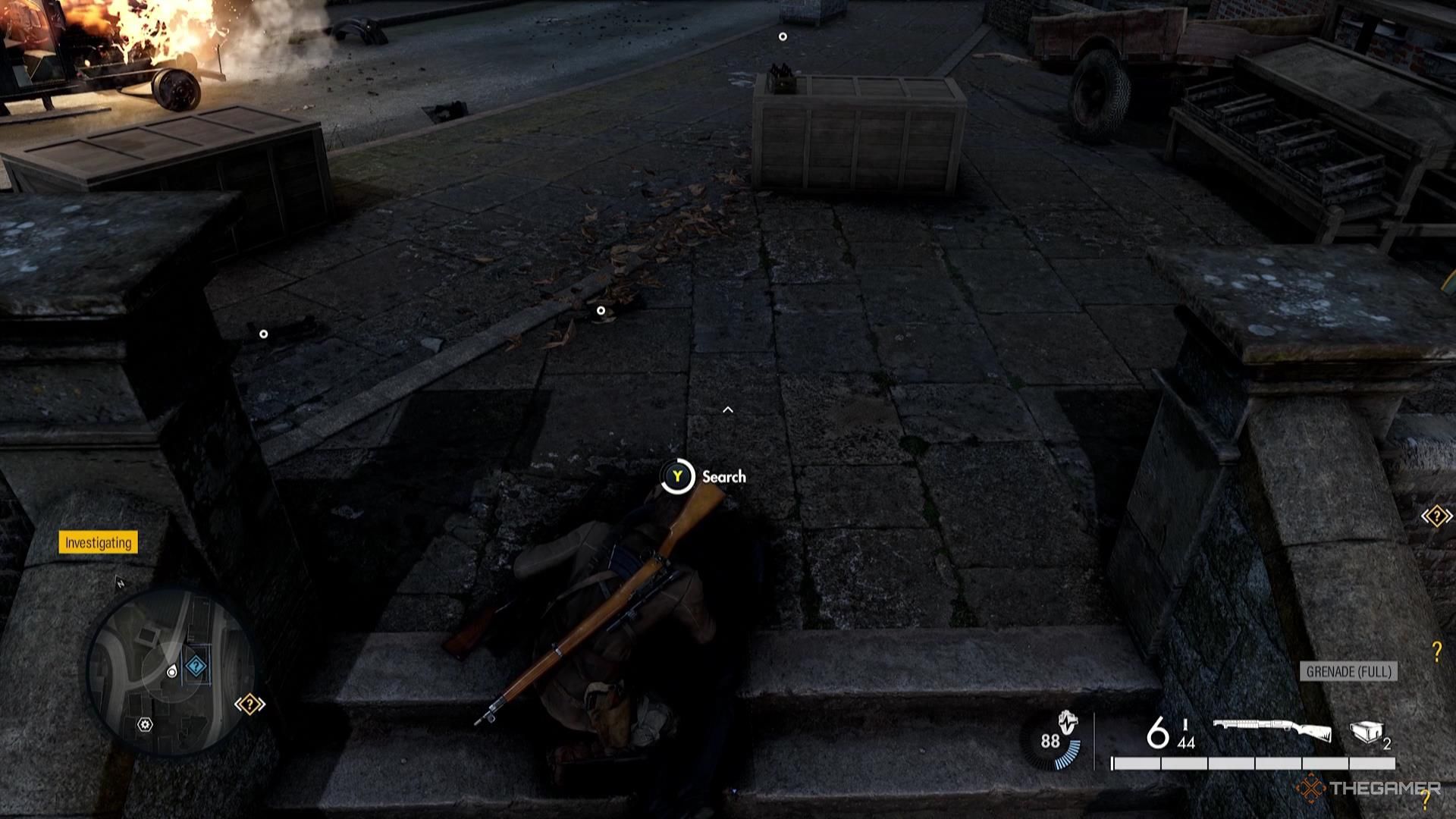 Harry takes a grenade from a Nazi corpse in Sniper Elite Resistance.