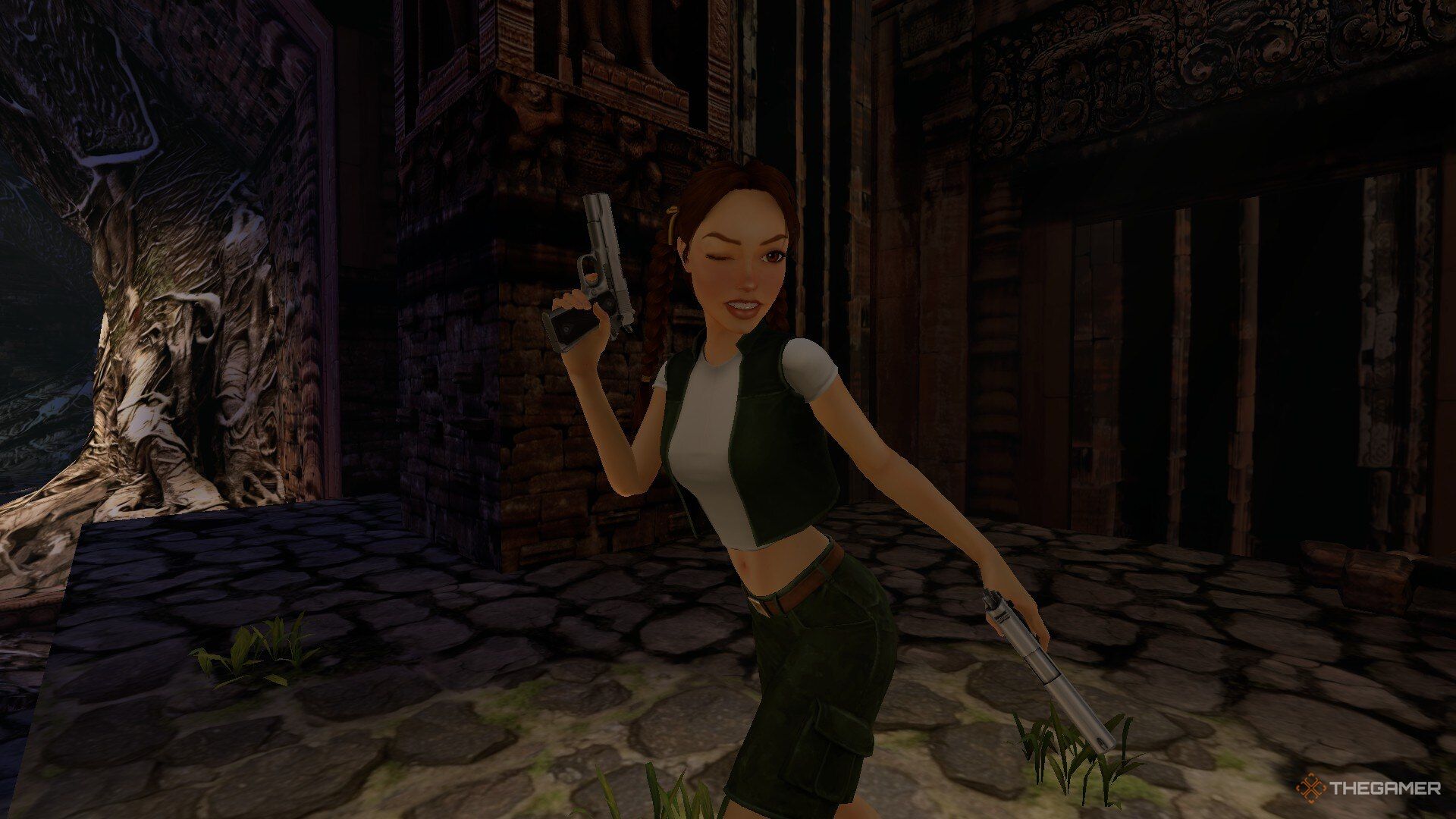 A young Lara winking while carrying pistols in Tomb Raider: The Last Revelation.