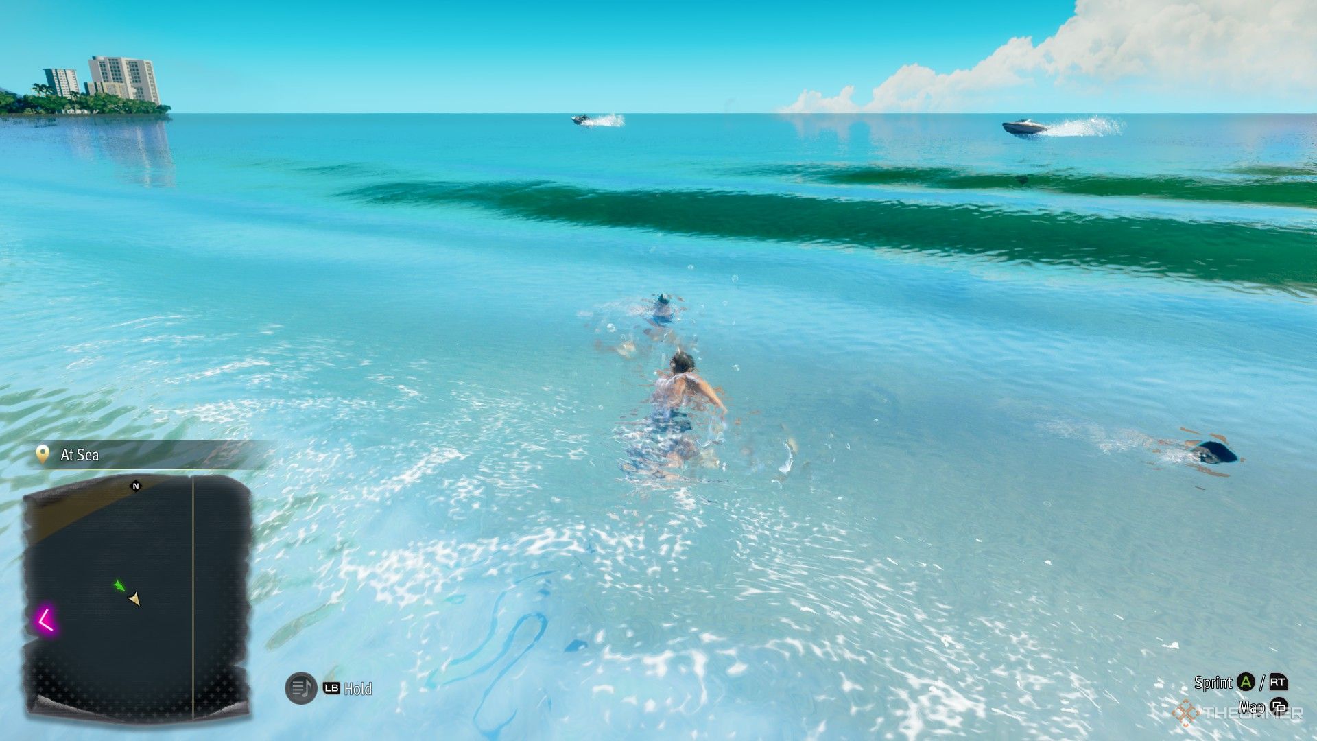 Majima swimming near a fish in Like a Dragon Pirate Yakuza in Hawaii.