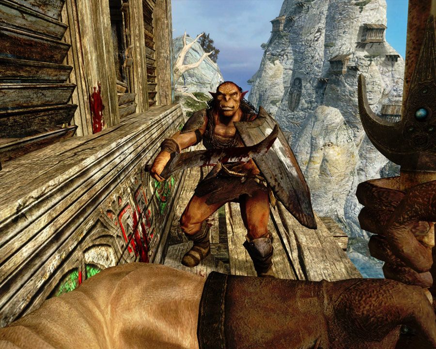 The player prepared to fight a goblin on a ledge in Dark Messiah. 