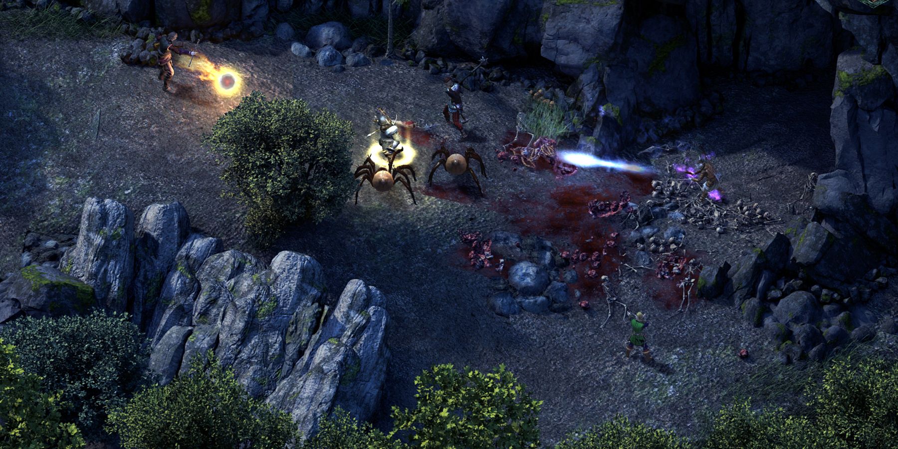 Adventurers battle giant spiders outside a rocky cave in Pillars of Eternity.