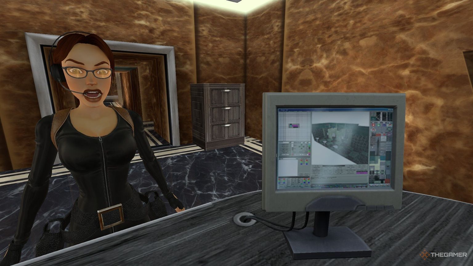 Lara next to a computer in Tomb Raider: Chronicles.