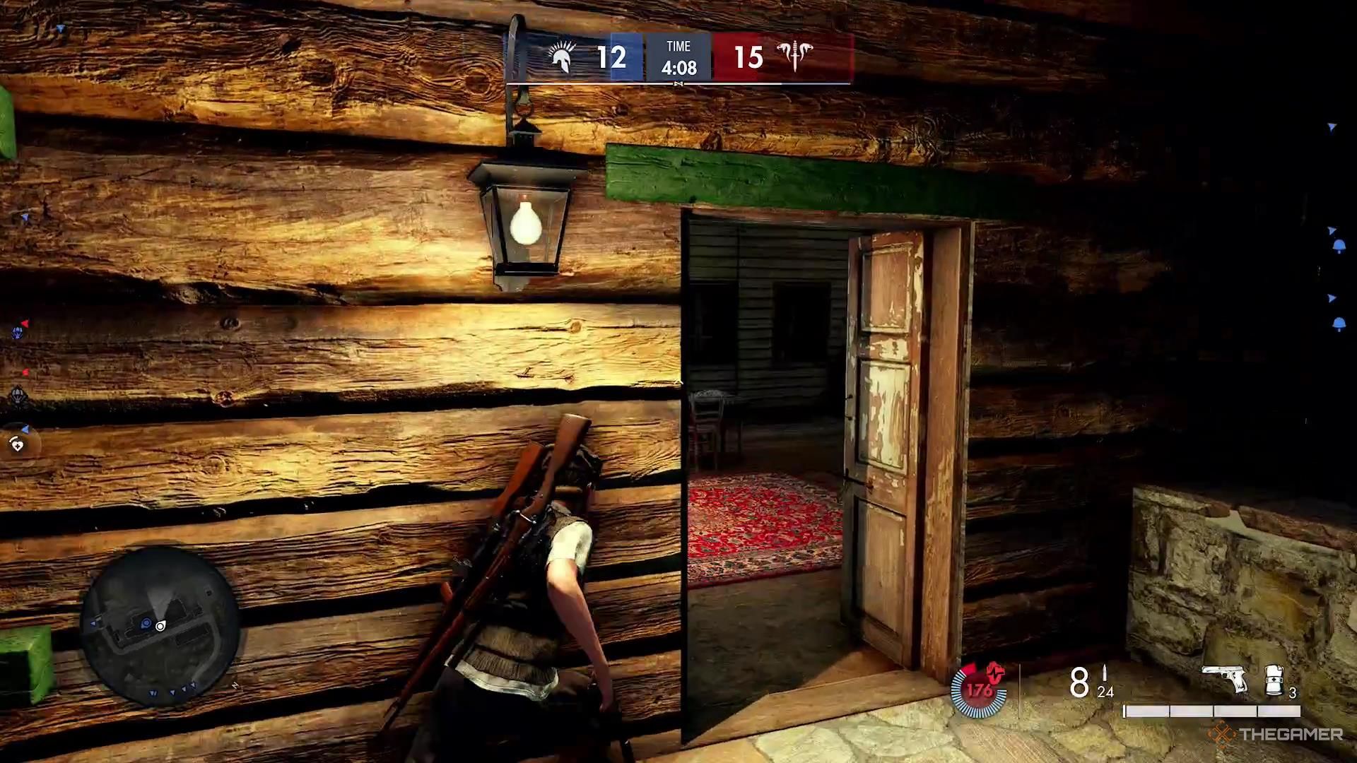 Running up a staircase toward an open door in Sniper Elite Resistance.