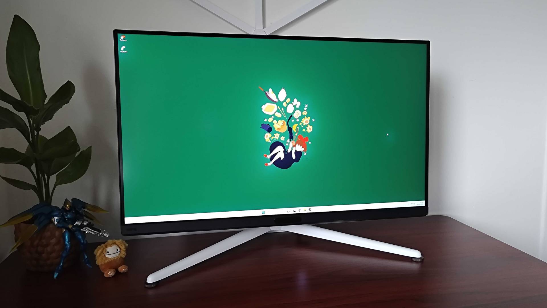 BenQ Mobiuz EX321UX with green Windows 11 wallpaper displayed and halo effect present