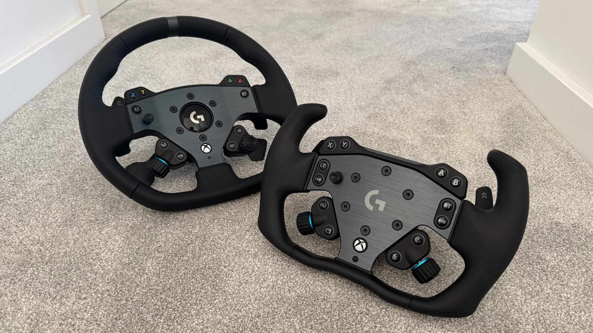 The Logitech G Pro racing wheel next to the new RS track wheel