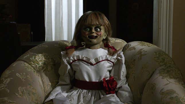 Annabelle from The Conjuring sitting scarily 