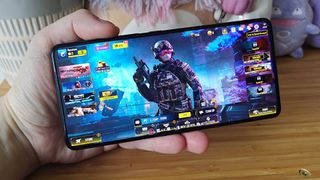 Asus ROG Phone 9 Pro with Call of Duty Mobile main menu on screen