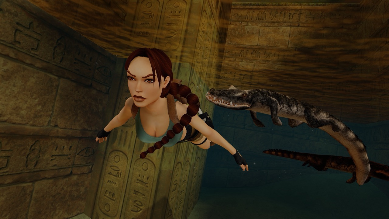 A screenshot shows Lara Croft swimming through water.