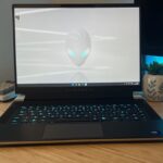 Alienware X16 R2 gaming laptop open on a wooden desk