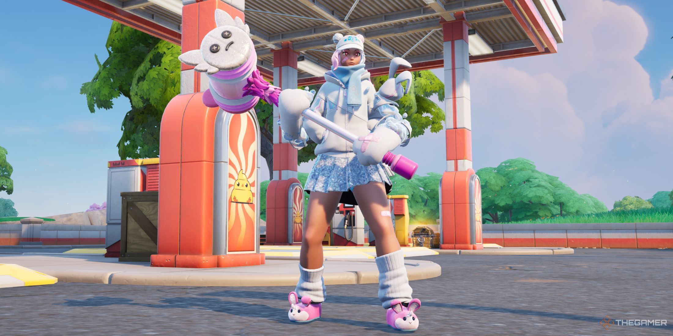 Fortnite character posing in front of a gas station.