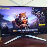 BenQ Mobiuz EX321UX monitor with Marvel Rivals Squirrel Girl on screen