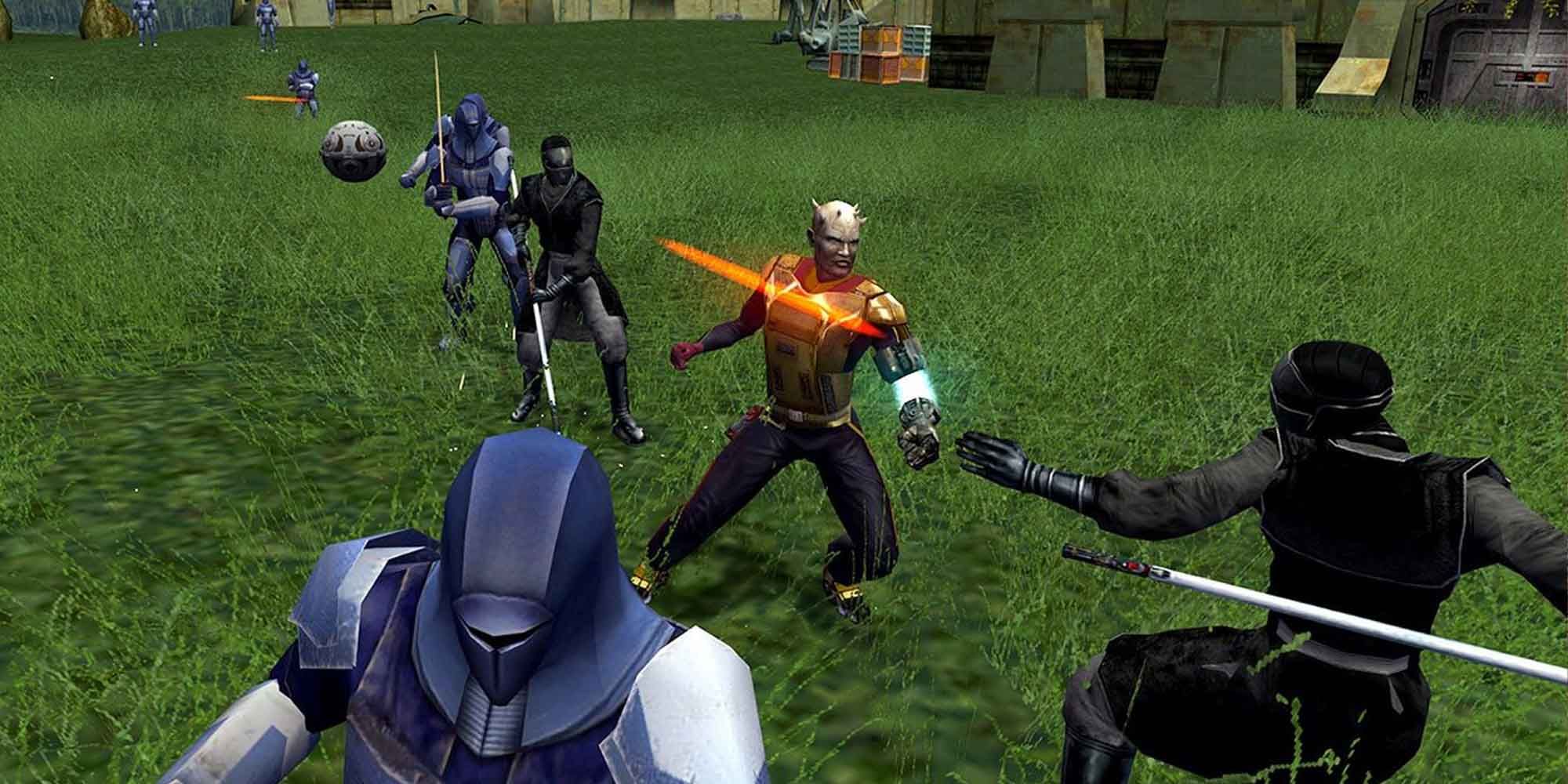 Fighting enemies on a grassy field in KOTOR