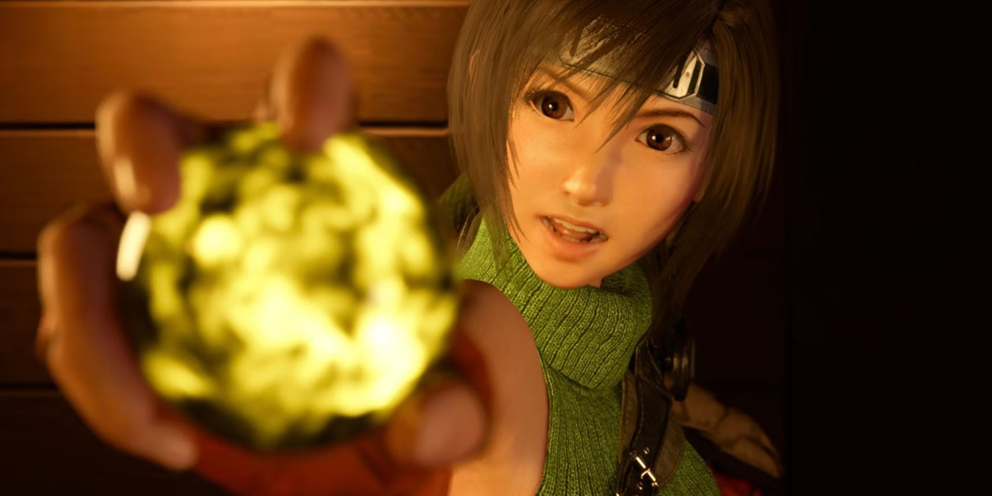 Yuffie holding up a Yellow Materia while looking at the screen in final fantasy 7 rebirth 