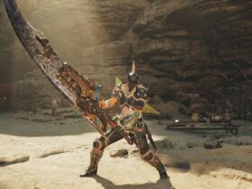 The player in Monster Hunter Wilds standing in the training area wielding the Great Sword.