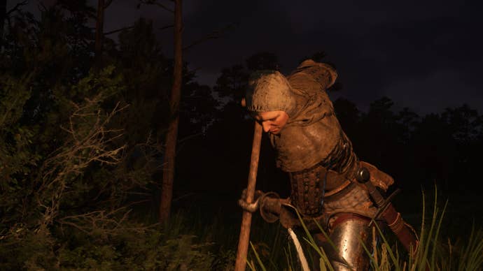 Henry using a shovel to dig a grave in Kingdom Come Deliverance 2.