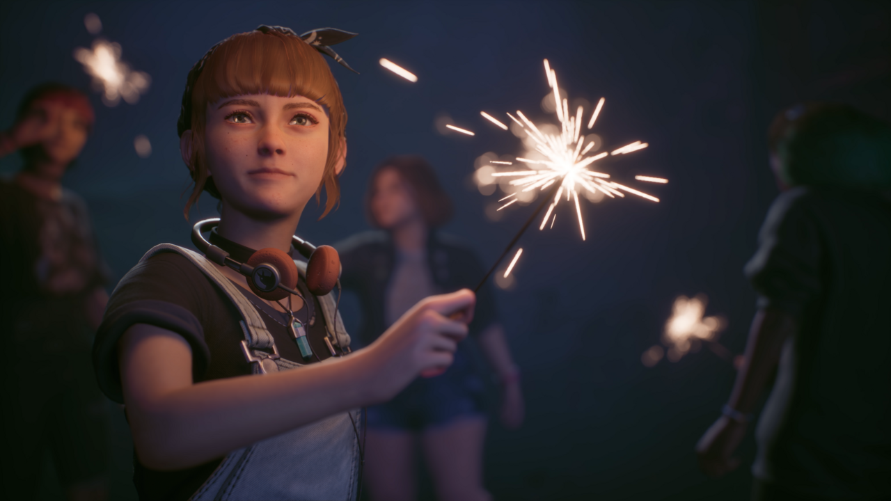 Kat holds a sparkler.