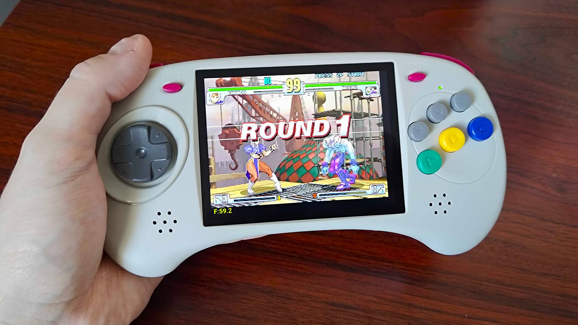 Anbernic RG ARC-D handheld with Street Fighter: Third Strike gameplay on screen