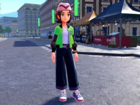 the female protagonist in pokemon legends z-a standing in a city street. she's wearing wide-legged pants, a series first