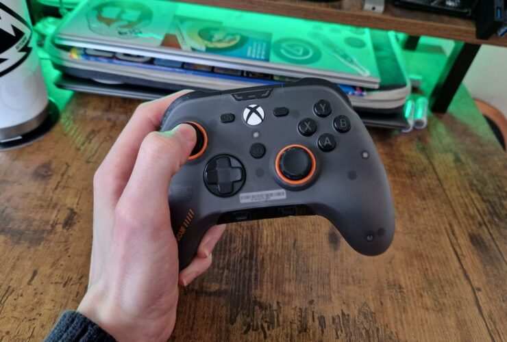 The Scuf Valor Pro being held by a reviewer